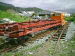 two new steel carriage chassis stacked on a freight train