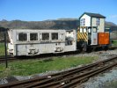 two very different locomotives; signalbox behind
