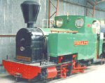 green steam locomotive in shed