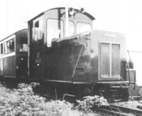 diesel locomotive with train; b/w