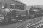 two locomotives surrounded by workshops