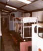 front view of the loco in its shed with grey undercoat on its unfinished bodywork