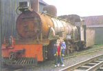 rusty NG15 surrounded by workshops; children posing